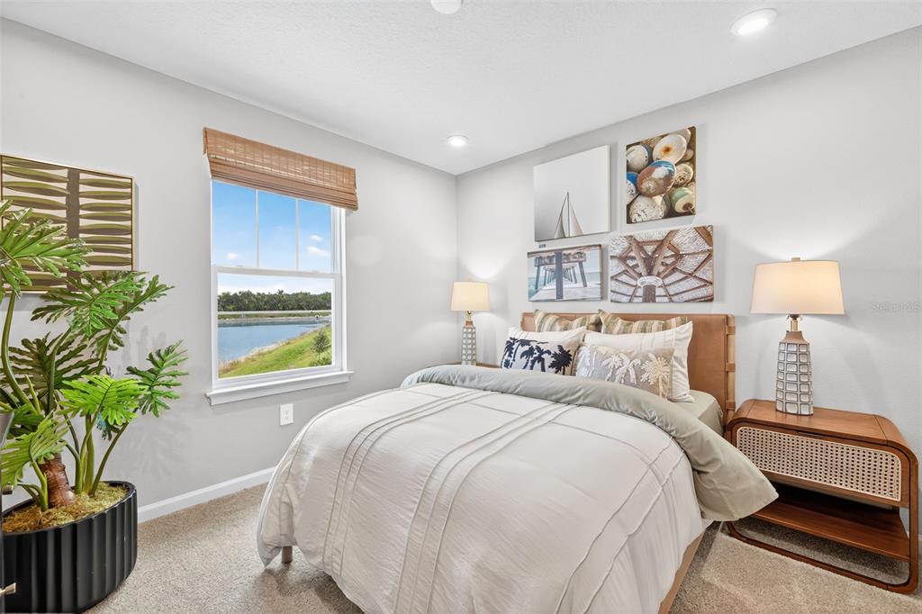 8838 Ginko Run Parrish, FL 34219 - Photo 15 of 21 a bedroom with a bed and a window
