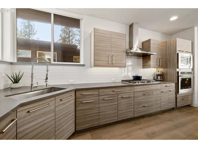 a kitchen with sink and window