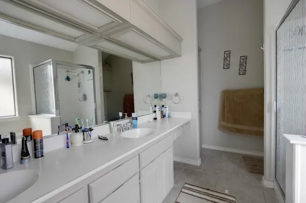 a bathroom with a sink and mirror