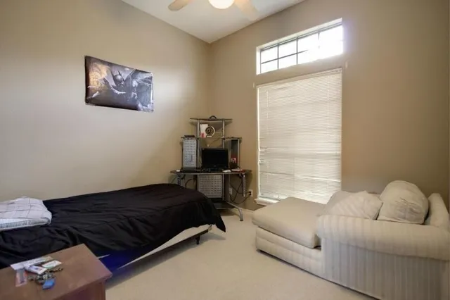 a living room with a couch and a window