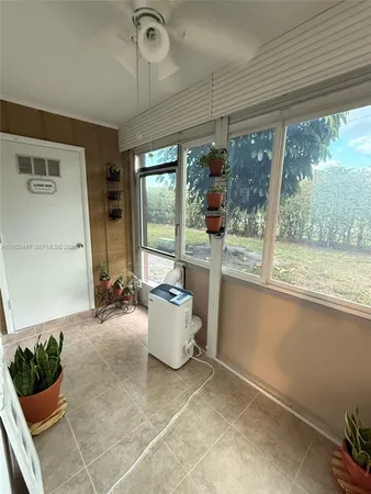 a view of a living room and outdoor space