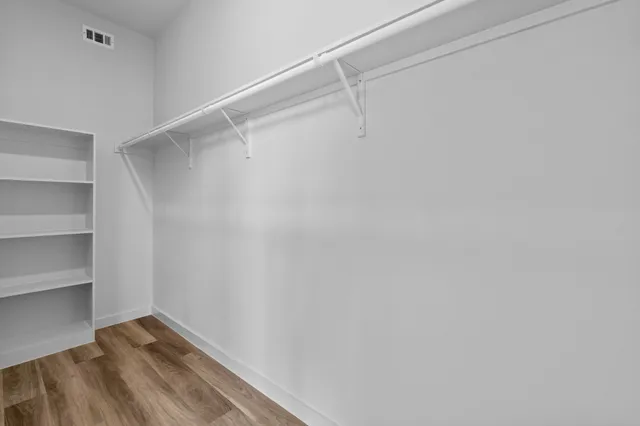 a view of an empty walk in closet