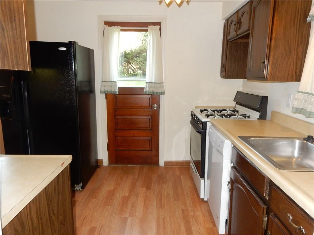 3719 Schuette Road Pittsburgh, PA 15227 - Photo 5 of 24 Another view of the kitchen, entry to outside is straight ahead. New flooring