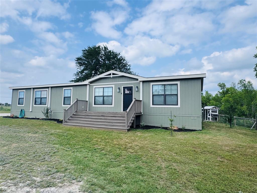 7268 Brangus Road Anna, TX 75409 - Photo 2 of 21 a front view of a house with yard
