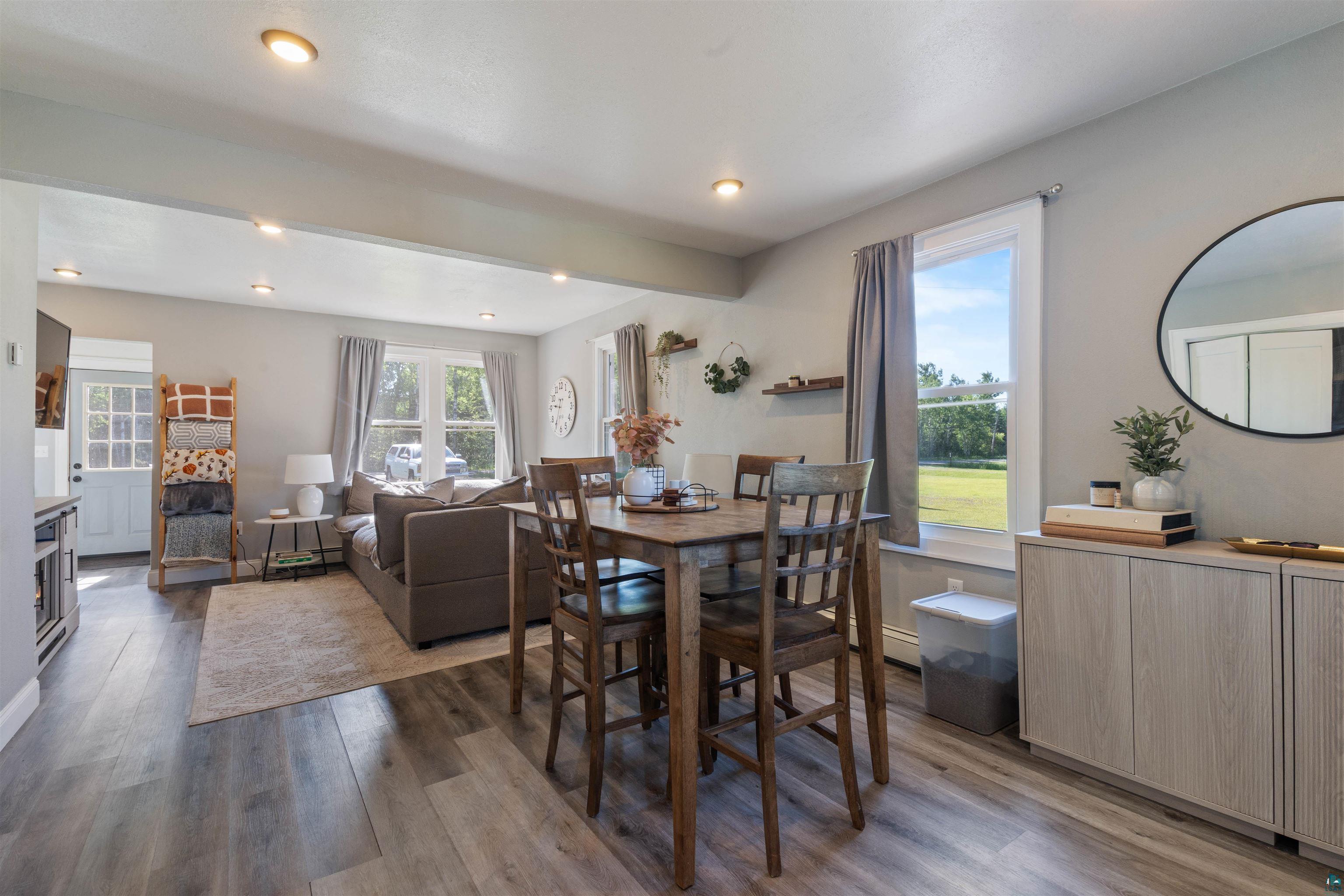 3835 South County Rd K South Range, WI 54874 - Photo 10 of 29 Open-concept living space featuring wood-finish flooring, recessed lighting, and light gray wall paint