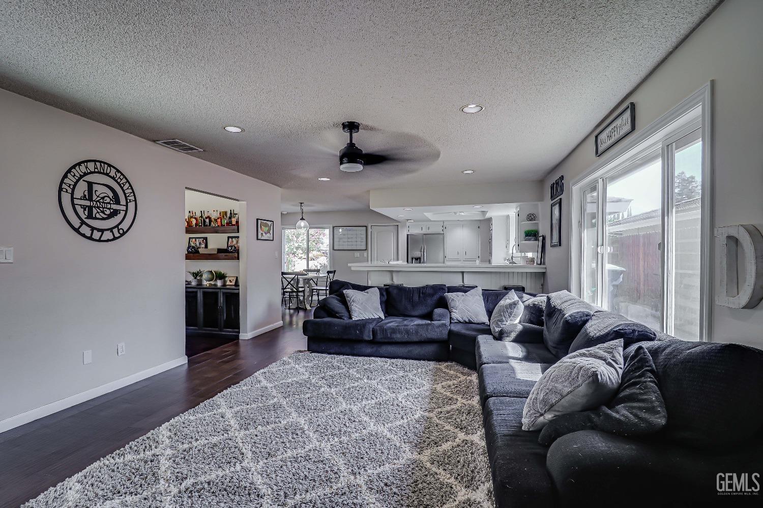Undisclosed Address Bakersfield, CA 93308 - Photo 11 of 38 a living room with furniture and a large window