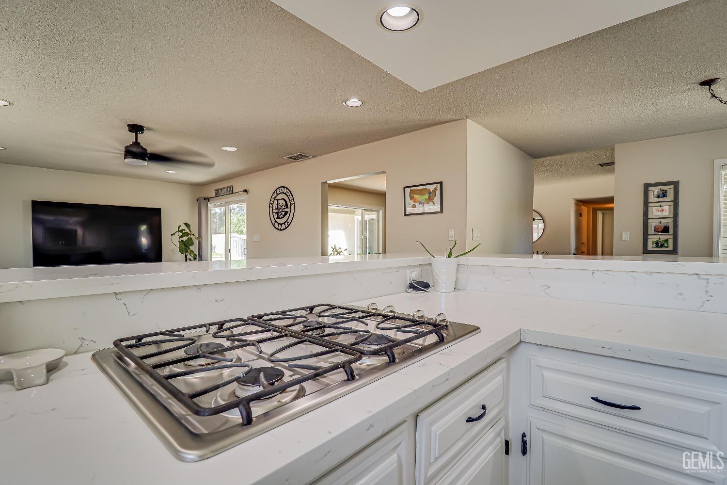 Undisclosed Address Bakersfield, CA 93308 - Photo 17 of 38 a stove top oven sitting inside of a kitchen