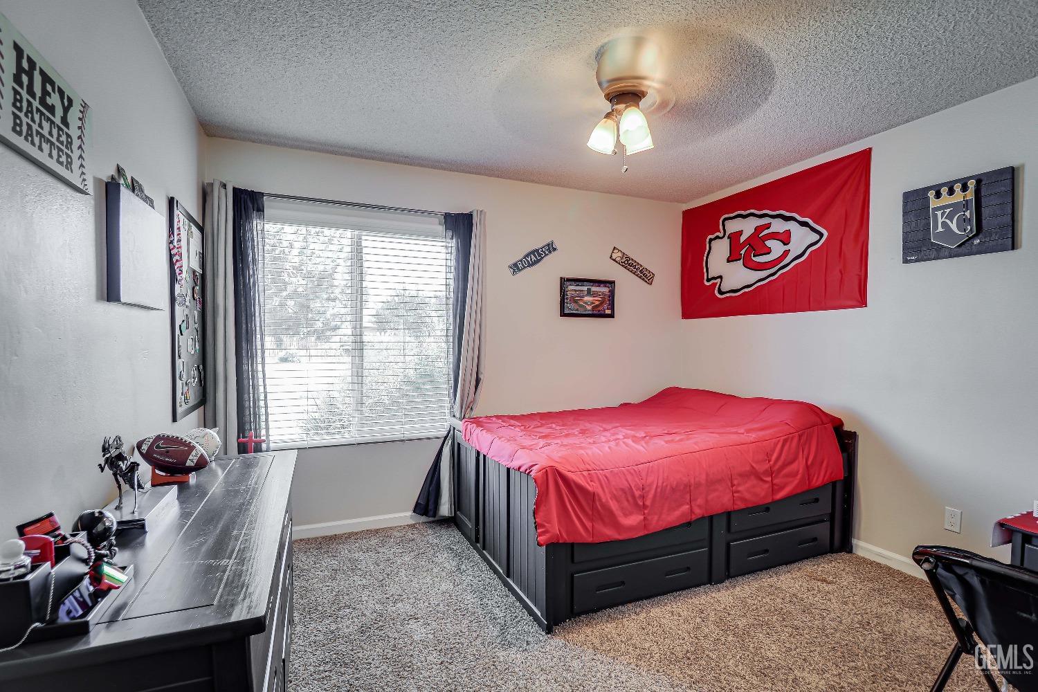 Undisclosed Address Bakersfield, CA 93308 - Photo 23 of 38 a bed room with a bed and a window