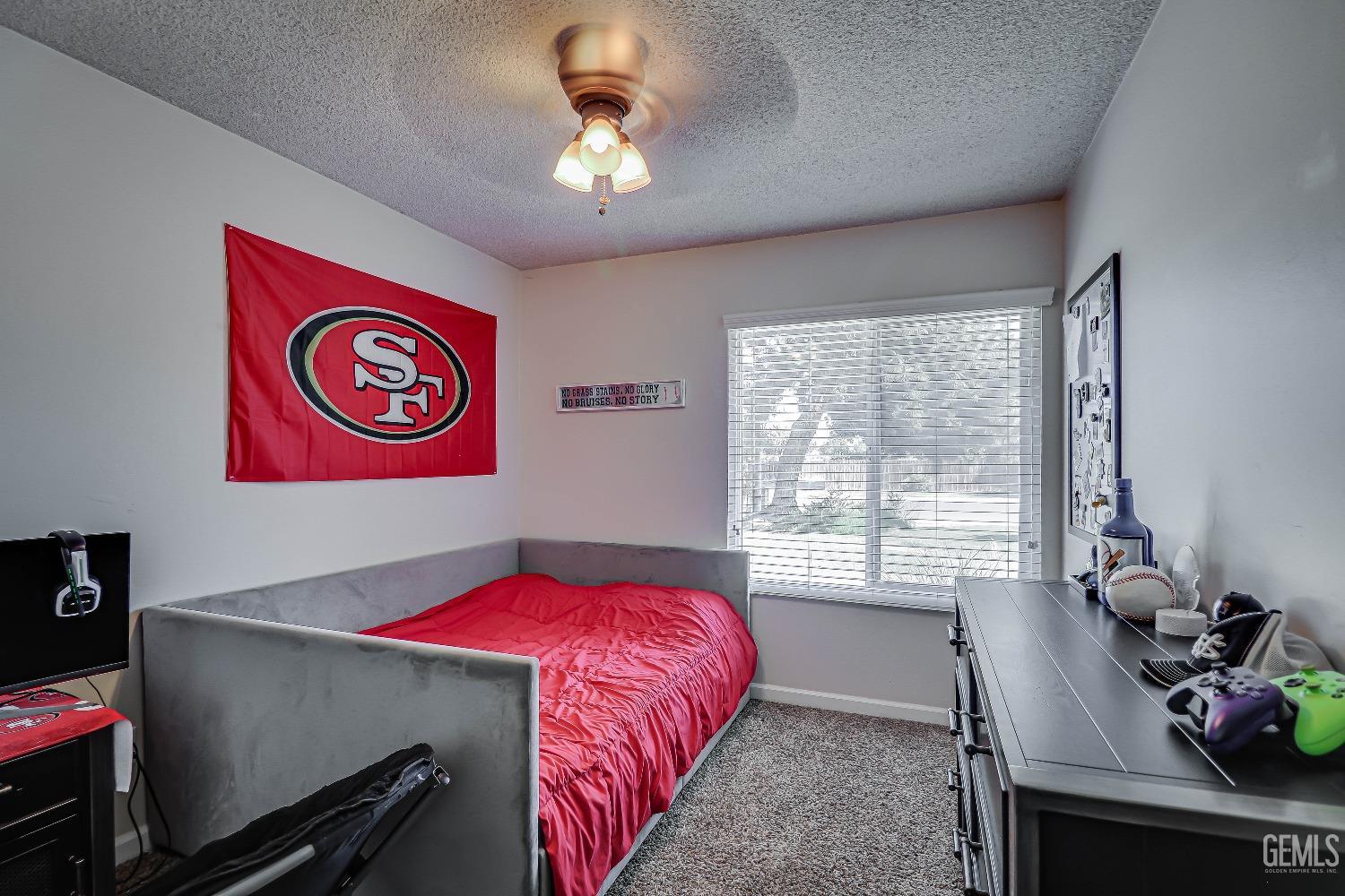 Undisclosed Address Bakersfield, CA 93308 - Photo 25 of 38 a bedroom with a bed and a window