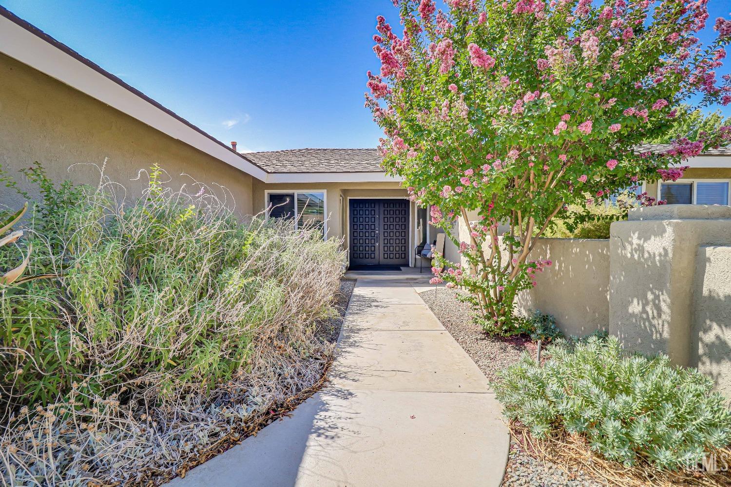Undisclosed Address Bakersfield, CA 93308 - Photo 4 of 38 a front view of a house with a yard