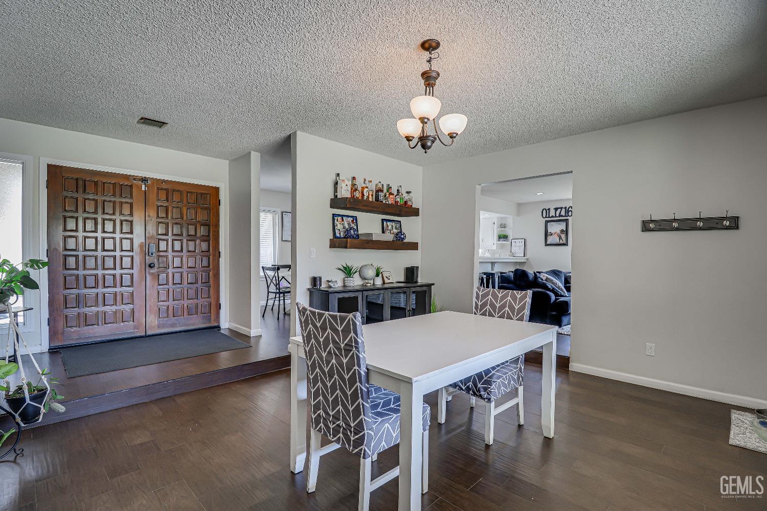 Undisclosed Address Bakersfield, CA 93308 - Photo 6 of 38 a view of a dining room with furniture window and wooden floor