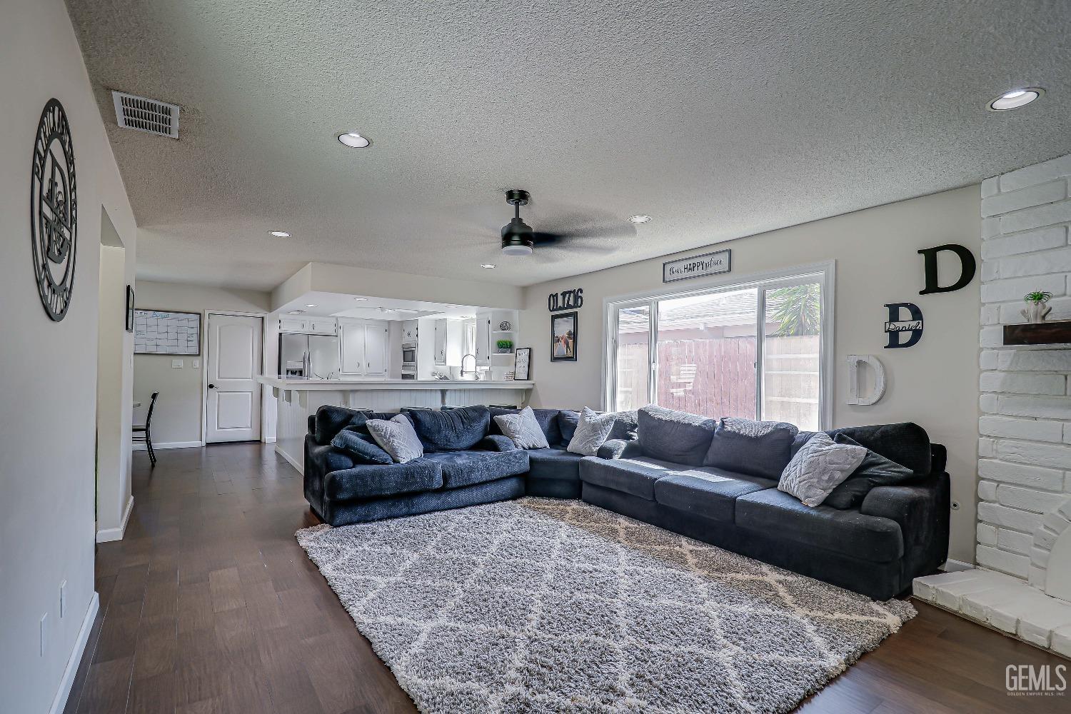 Undisclosed Address Bakersfield, CA 93308 - Photo 10 of 38 a living room with furniture and a couch