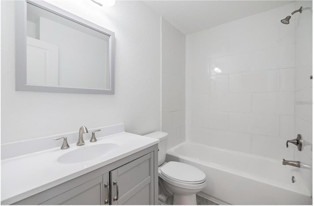 1264 Pierce Street Clearwater, FL 33756 - Photo 11 of 16 a bathroom with a sink toilet and bathtub