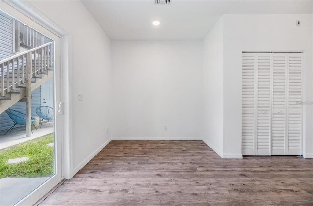 1264 Pierce Street Clearwater, FL 33756 - Photo 5 of 16 a view of an empty room with wooden floor