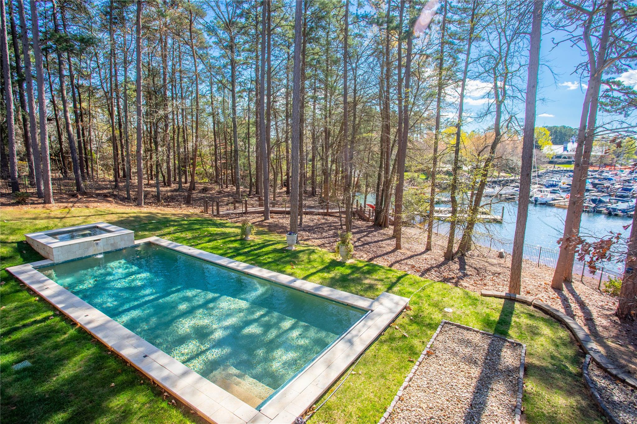 16824 Flying Jib Road Cornelius, NC 28031 - Photo 42 of 48 a view of swimming pool with lawn chairs and plants