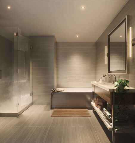 a bathroom with a tub sink and mirror