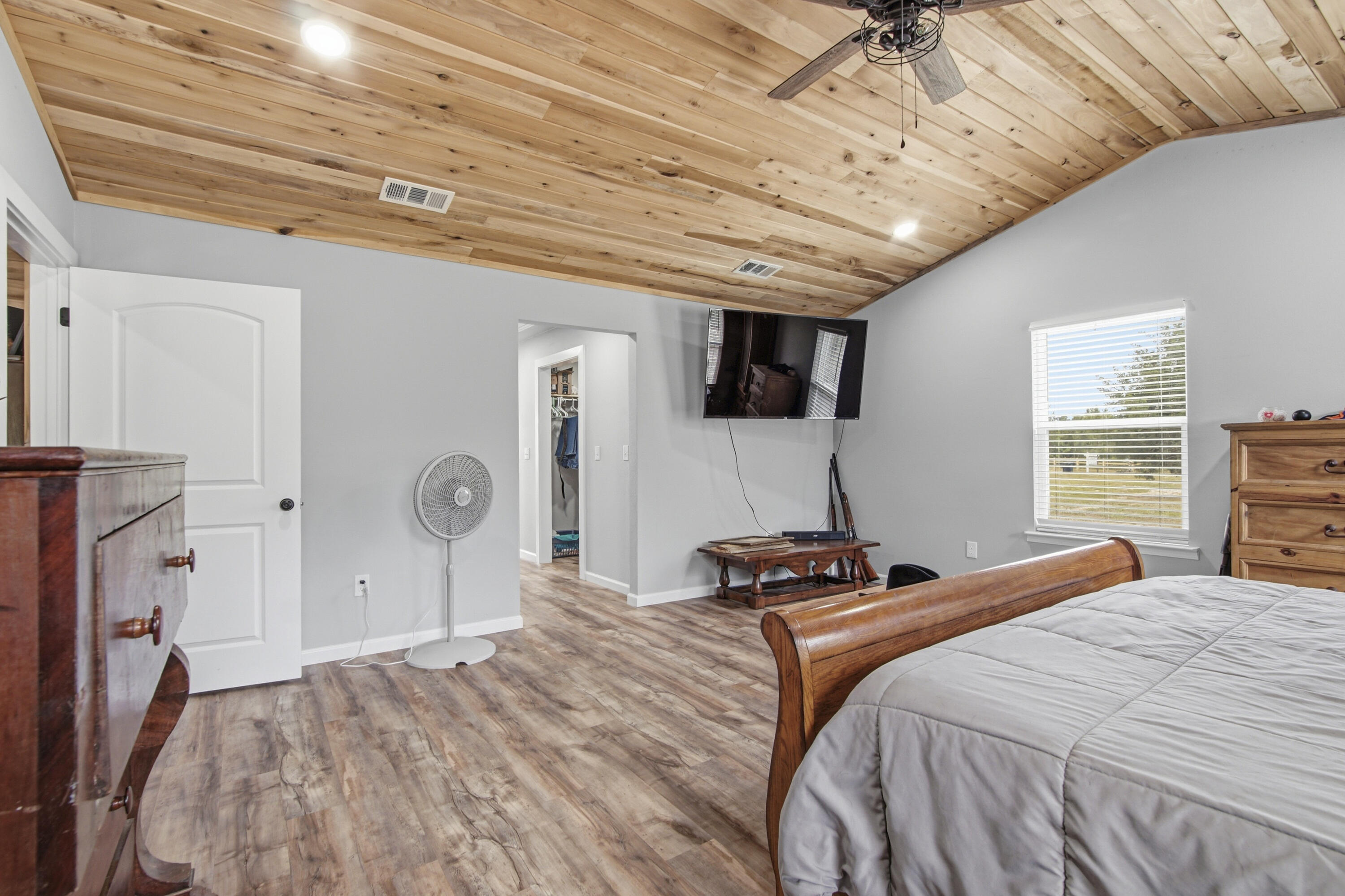 7514 Laird Road Florala, AL 36442 - Photo 17 of 48 a bedroom with a bed and a flat tv screen