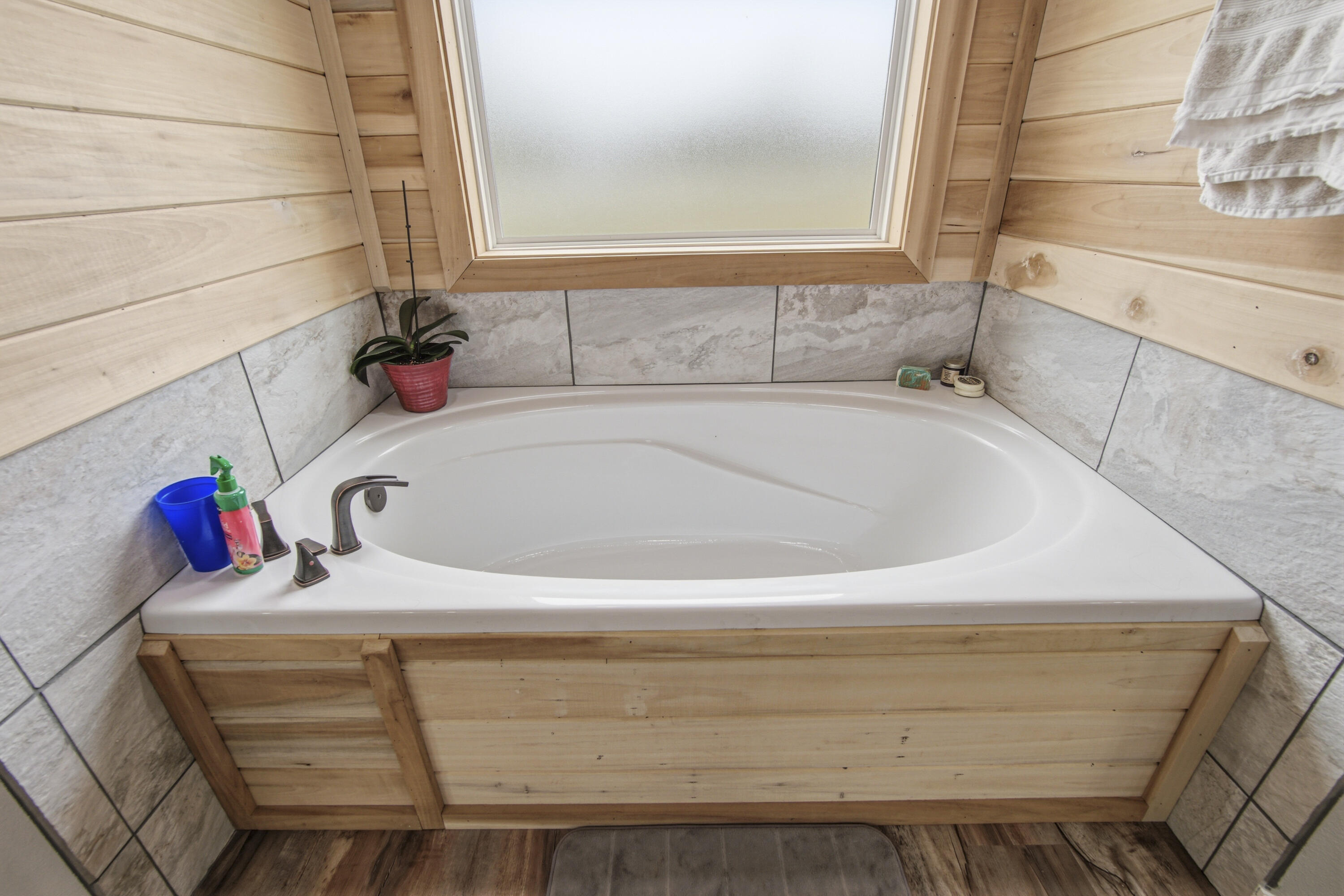7514 Laird Road Florala, AL 36442 - Photo 23 of 48 a bathroom with a tub sink and mirror