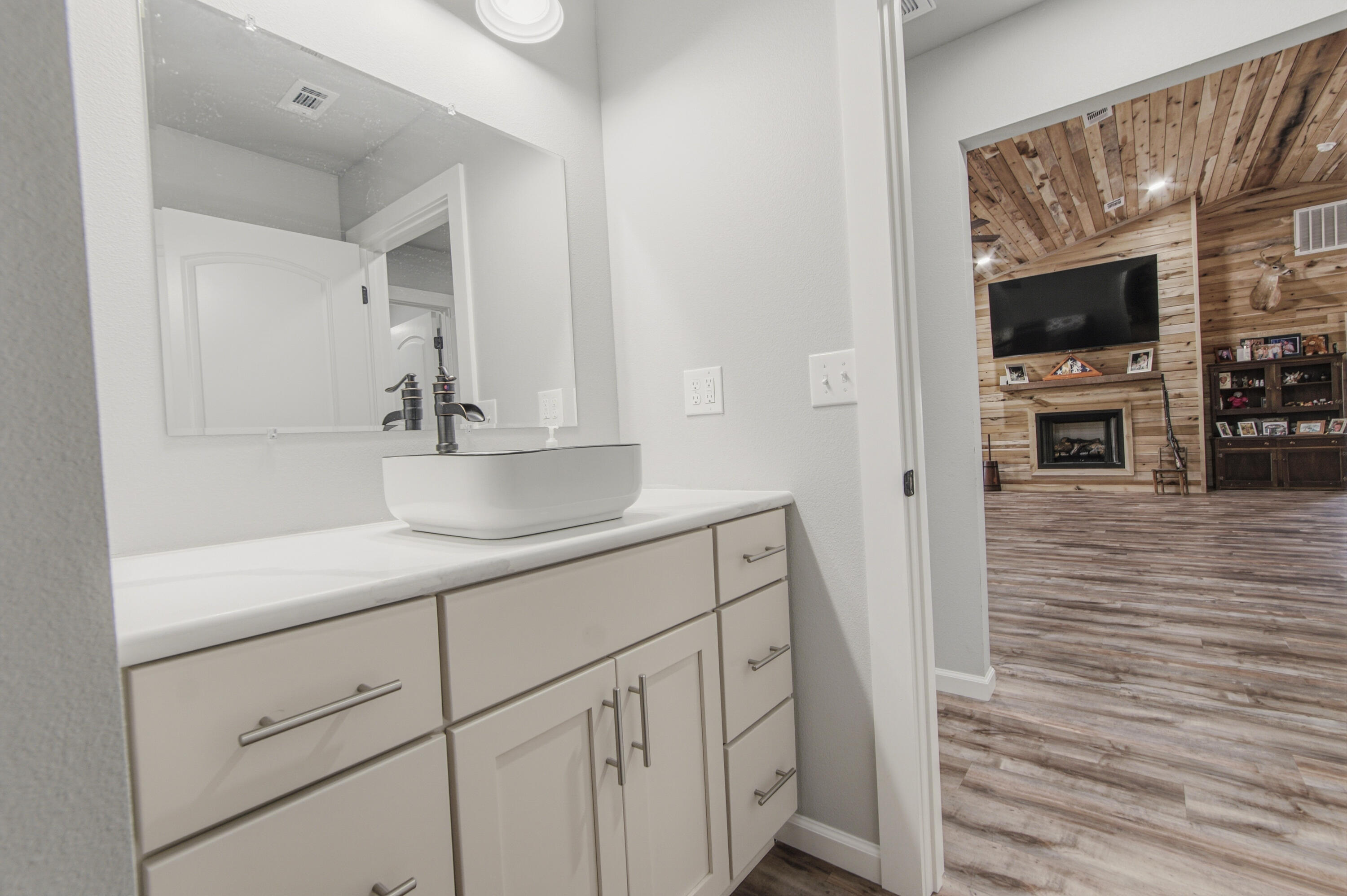7514 Laird Road Florala, AL 36442 - Photo 31 of 48 a bathroom with a sink a mirror and shower