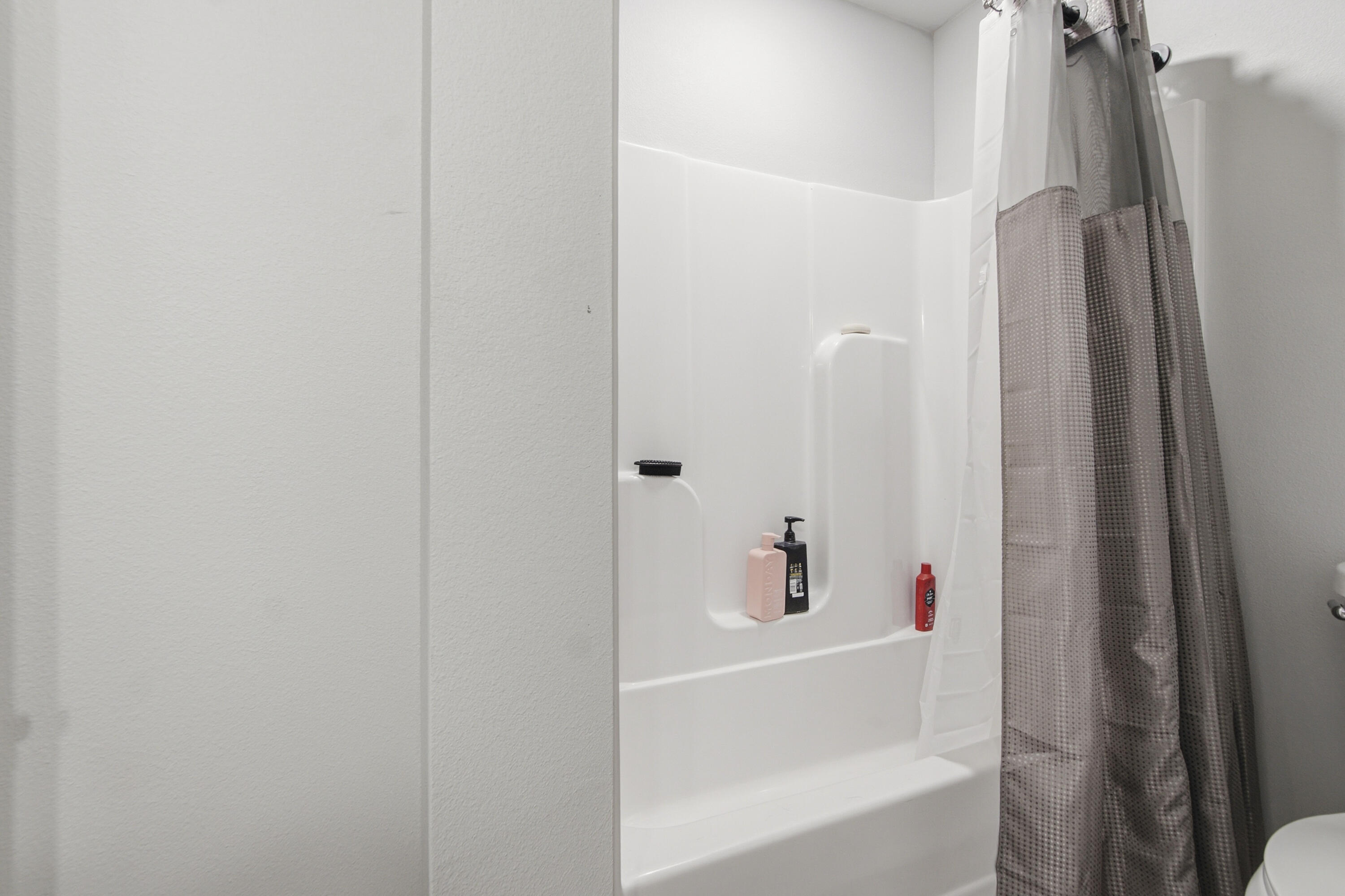 7514 Laird Road Florala, AL 36442 - Photo 32 of 48 a bathroom with a bathtub and shower