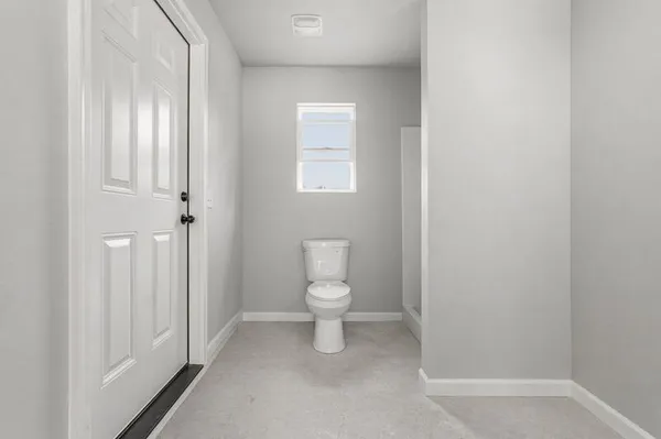a bathroom with a toilet