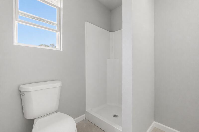 7514 Laird Road Florala, AL 36442 - Photo 35 of 48 a white toilet sitting next to a shower