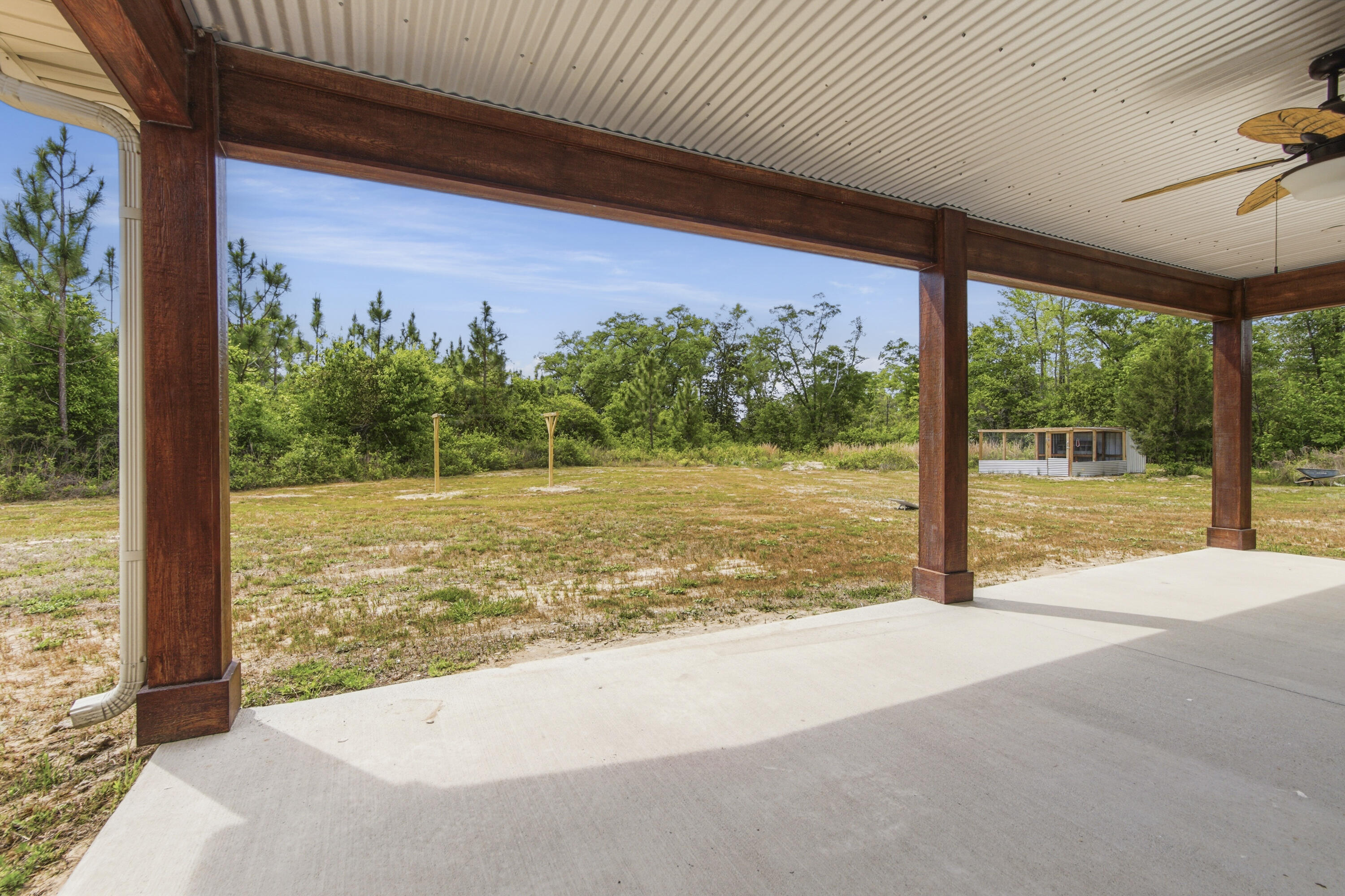 7514 Laird Road Florala, AL 36442 - Photo 41 of 48 a view of a room with floor to ceiling windows and a big yard