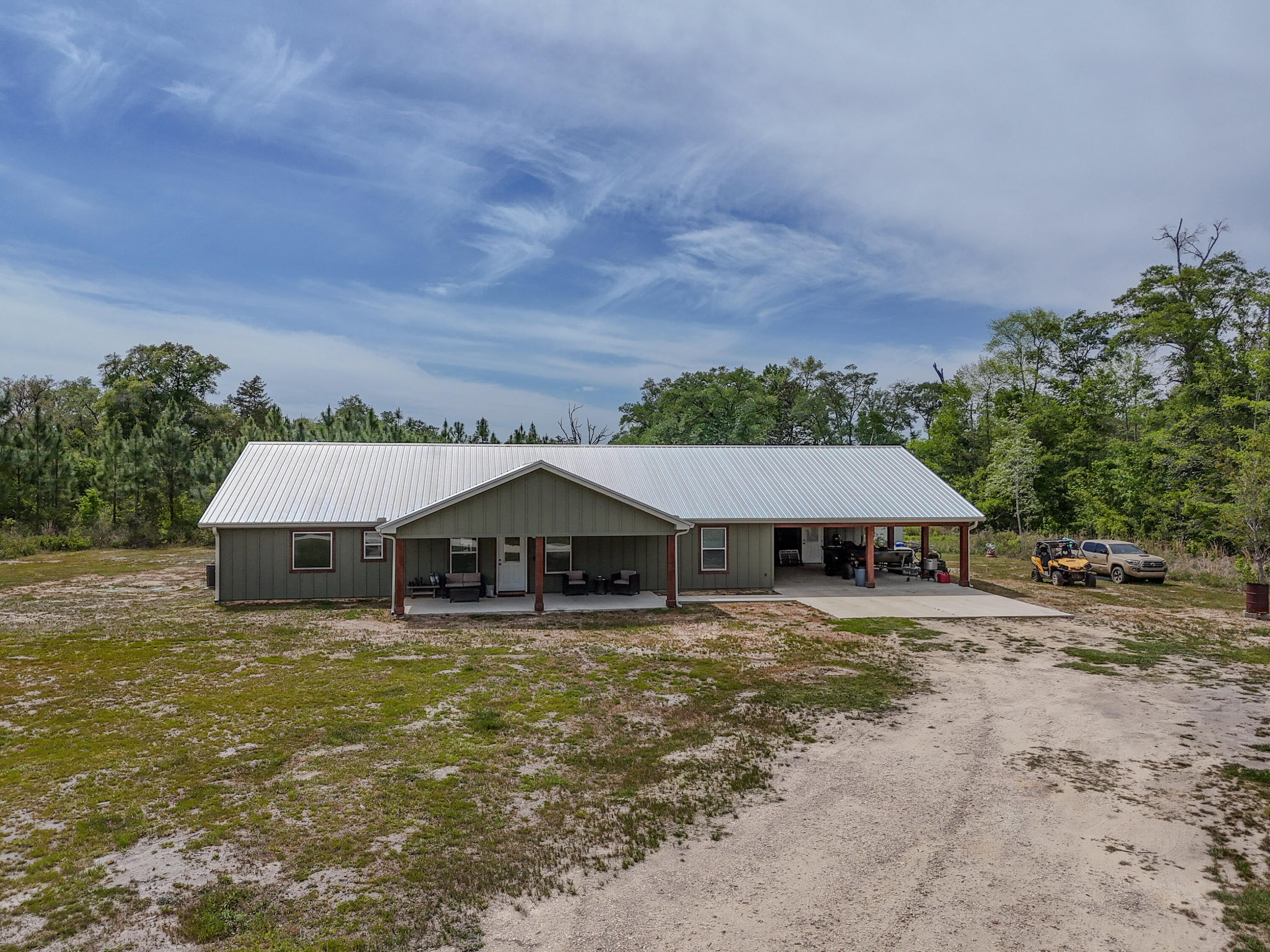 7514 Laird Road Florala, AL 36442 - Photo 45 of 48 an aerial view of a house with a yard and large trees