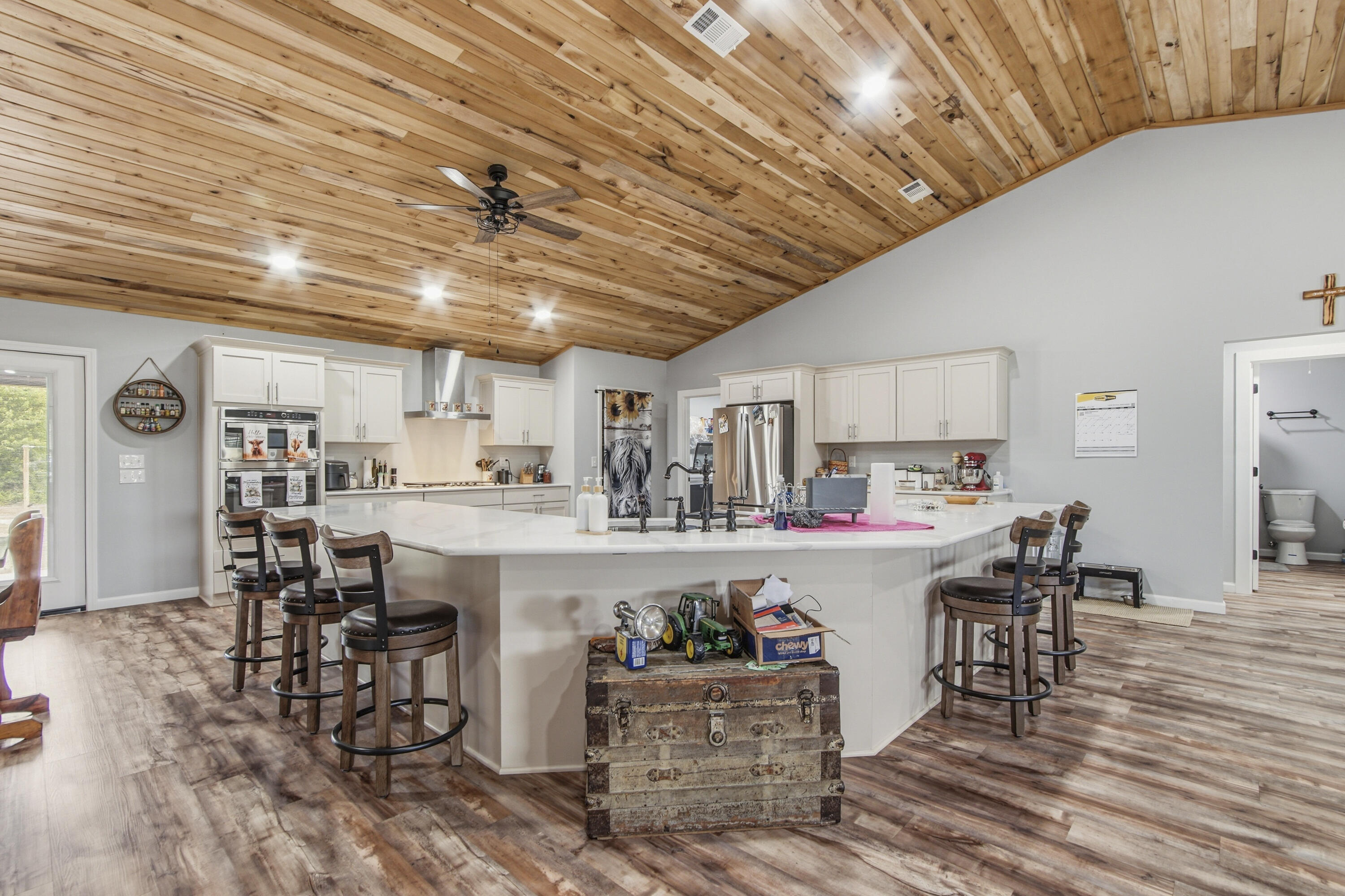 7514 Laird Road Florala, AL 36442 - Photo 8 of 48 a kitchen with cabinets and wooden floor