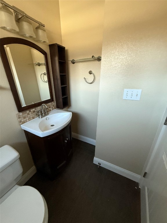1313 Delano Street Austin, TX 78721 - Photo 13 of 32 Bathroom with vanity and tasteful backsplash