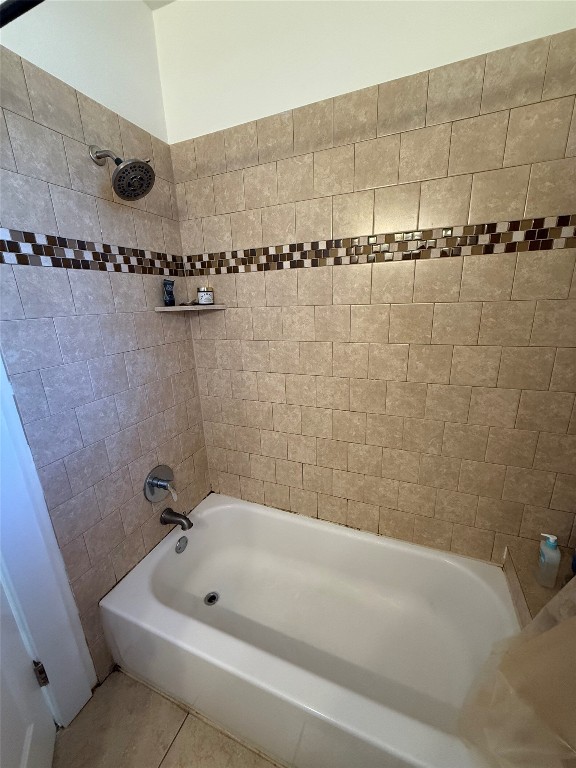 1313 Delano Street Austin, TX 78721 - Photo 18 of 32 Bathroom featuring tub / shower combination and tile patterned floors