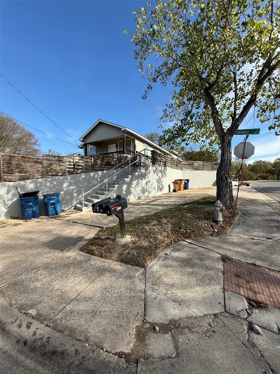 1313 Delano Street Austin, TX 78721 - Photo 29 of 32 View of side of home with stairs