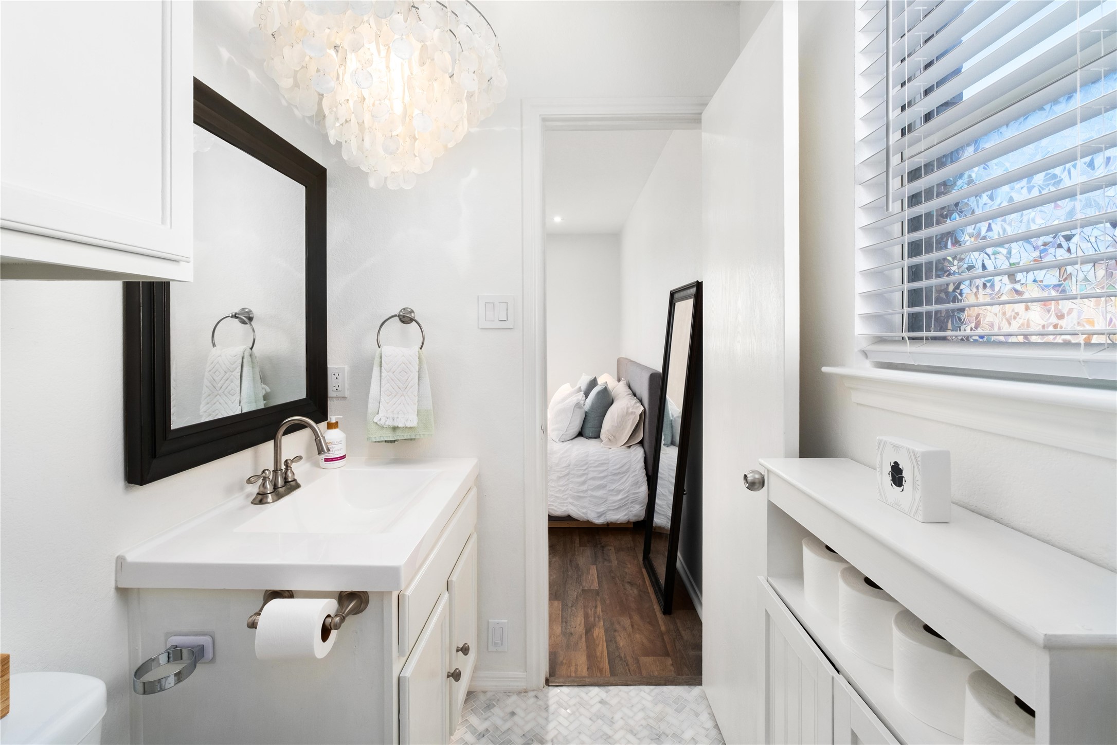 102 Woodley Road Leander, TX 78641 - Photo 12 of 24 a en suite bathroom with a sink double vanity and mirror