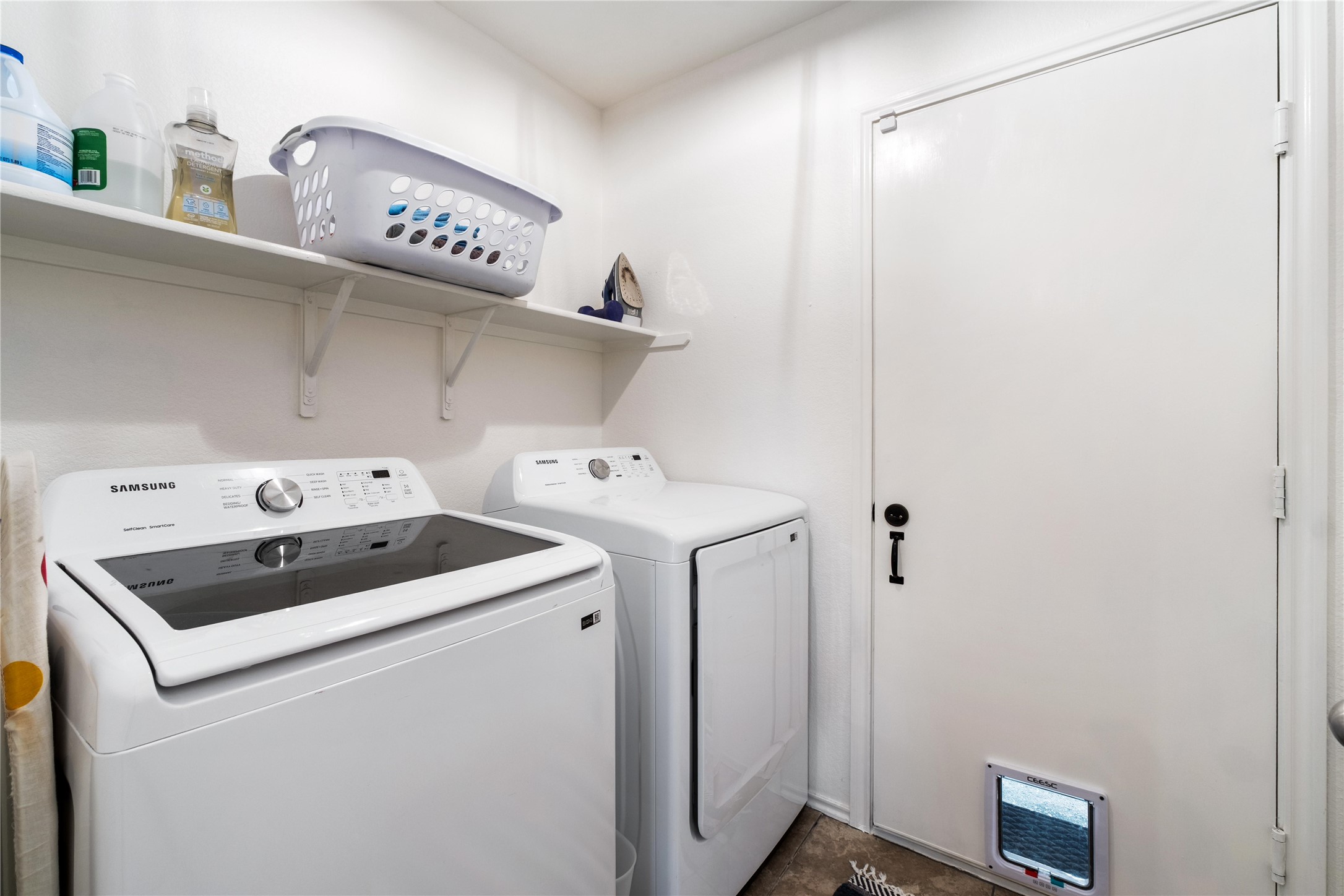 102 Woodley Road Leander, TX 78641 - Photo 16 of 24 a utility room with dryer and washer