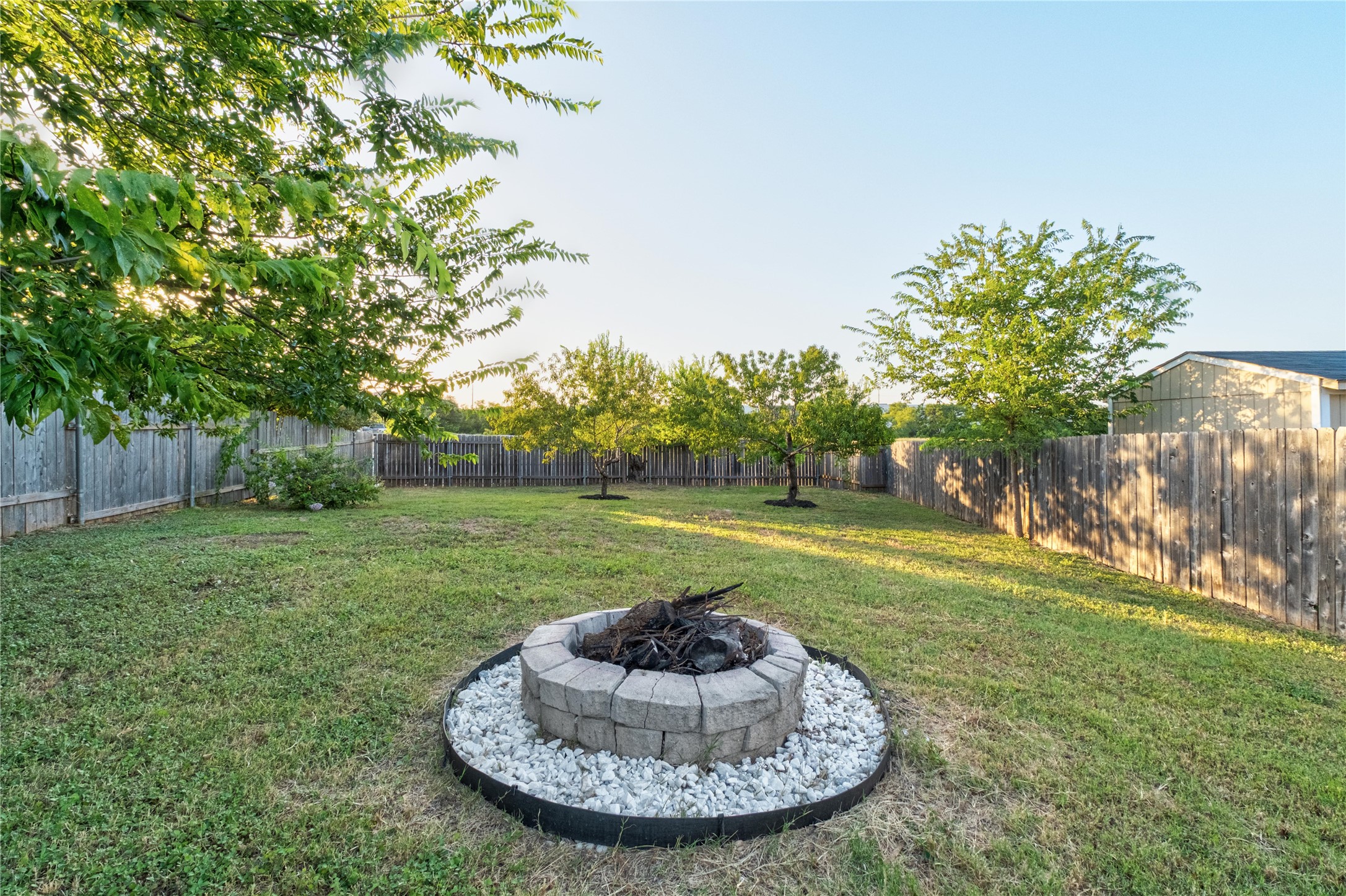 102 Woodley Road Leander, TX 78641 - Photo 20 of 24 a view of a house with a backyard
