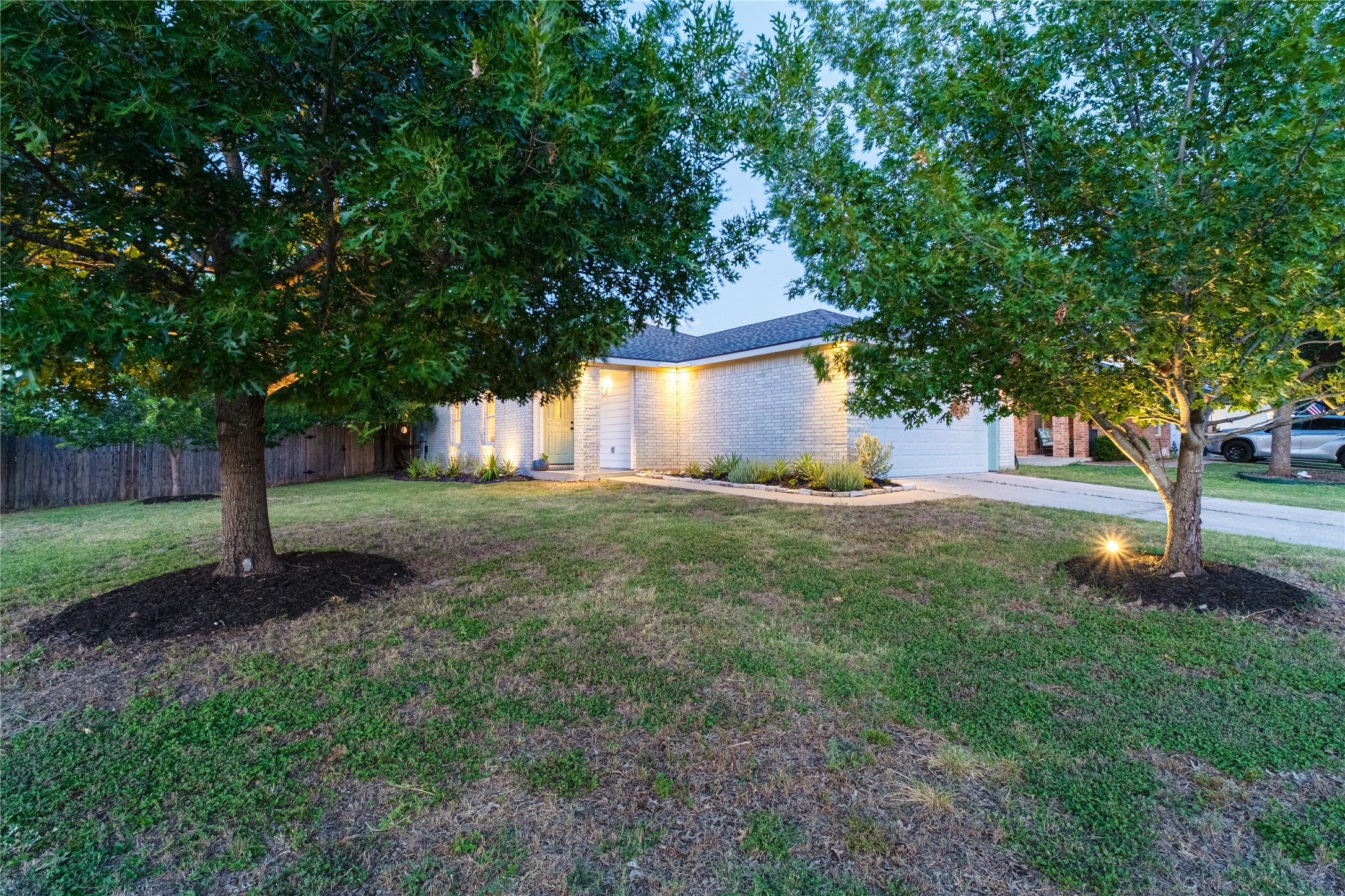 102 Woodley Road Leander, TX 78641 - Photo 24 of 24 a view of a tree in front of a house