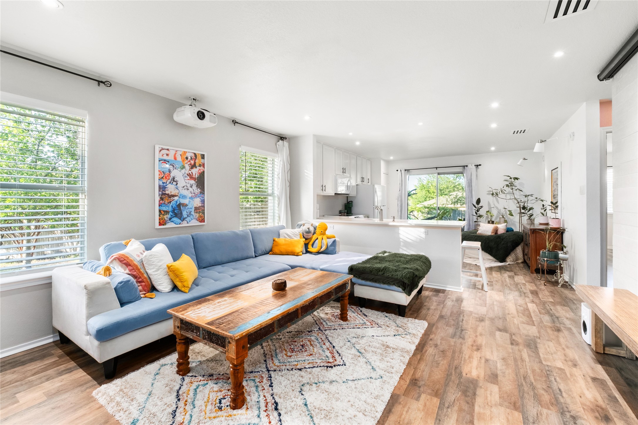102 Woodley Road Leander, TX 78641 - Photo 3 of 24 a living room with furniture and a rug