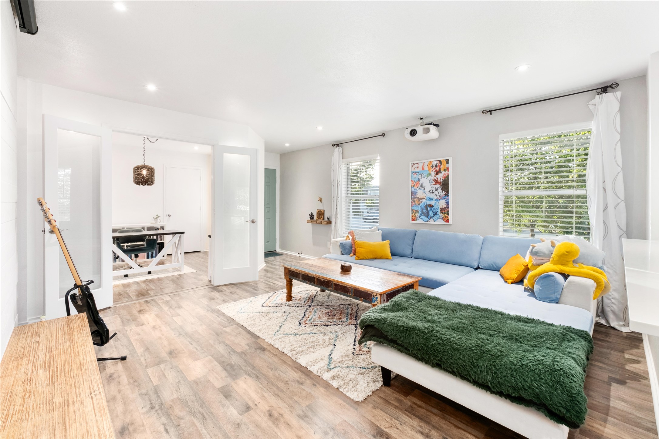 102 Woodley Road Leander, TX 78641 - Photo 4 of 24 a living room with furniture and a flat screen tv