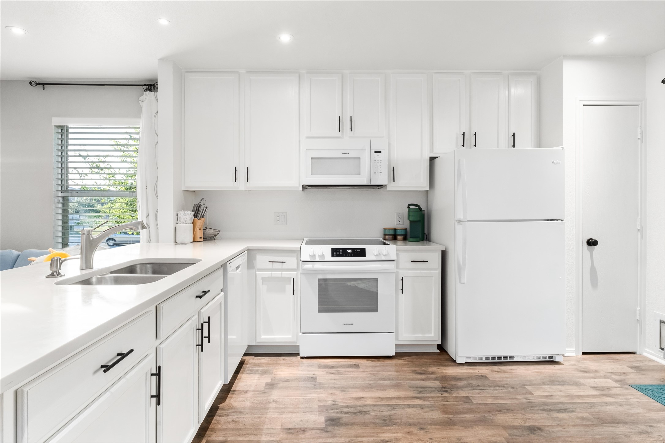 102 Woodley Road Leander, TX 78641 - Photo 6 of 24 a kitchen with cabinets appliances and a window