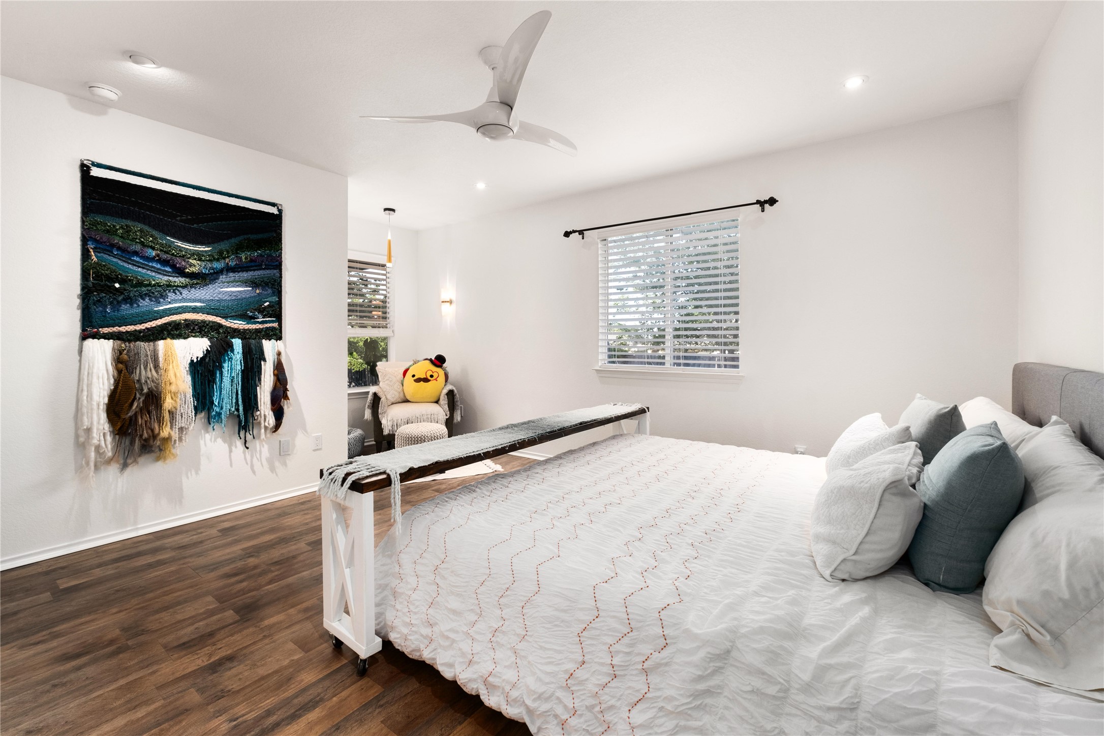 102 Woodley Road Leander, TX 78641 - Photo 10 of 24 a bedroom with a bed and a flat screen tv