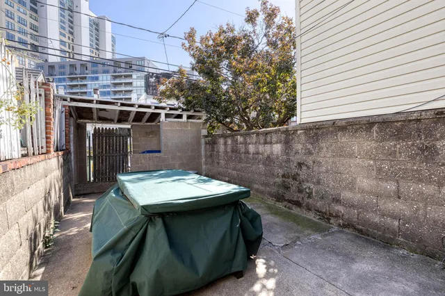 a view of a dinning table and chairs in patio