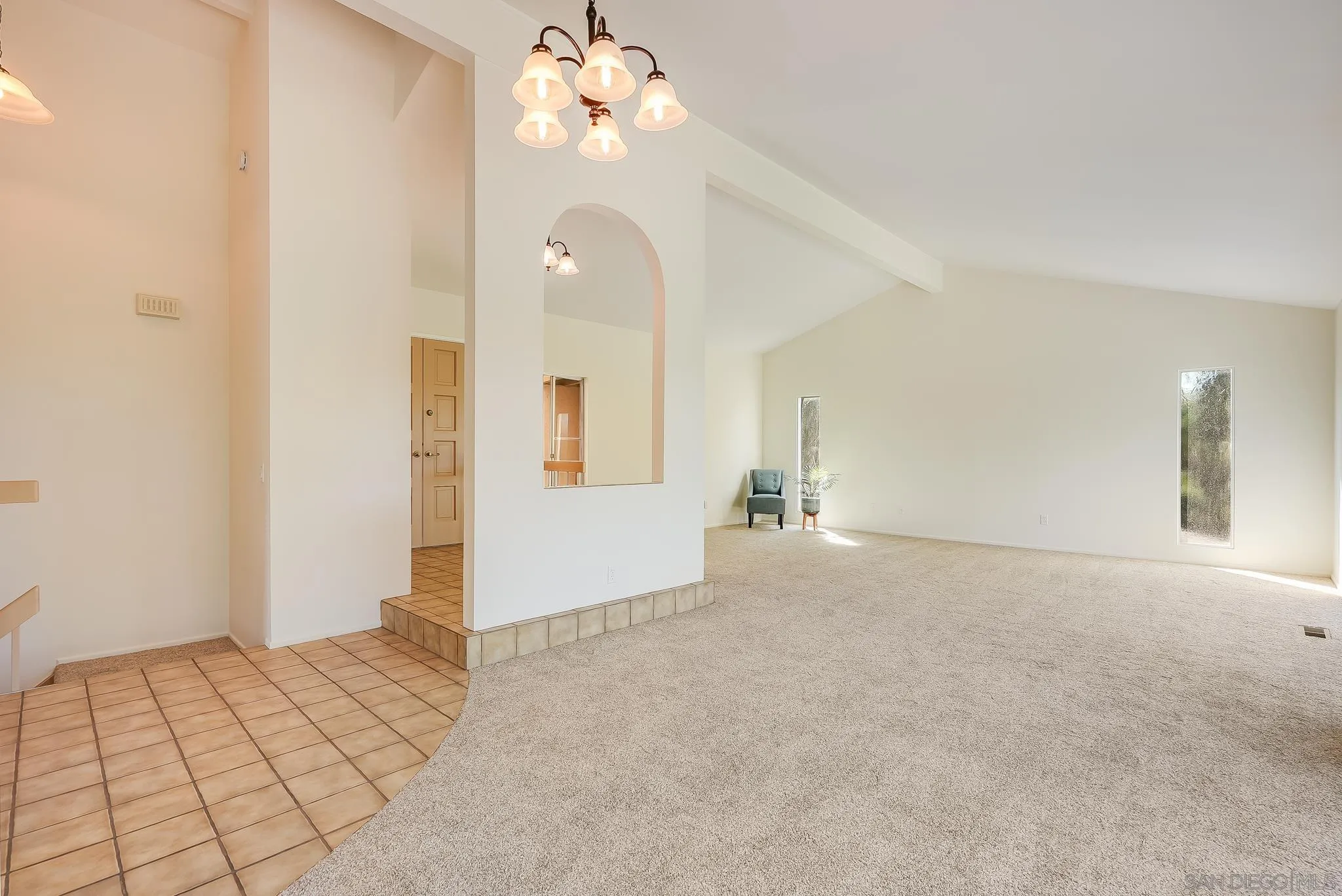 16456 Martincoit Road Poway, CA 92064 - Photo 12 of 55 a view of an empty room with a chandelier fan