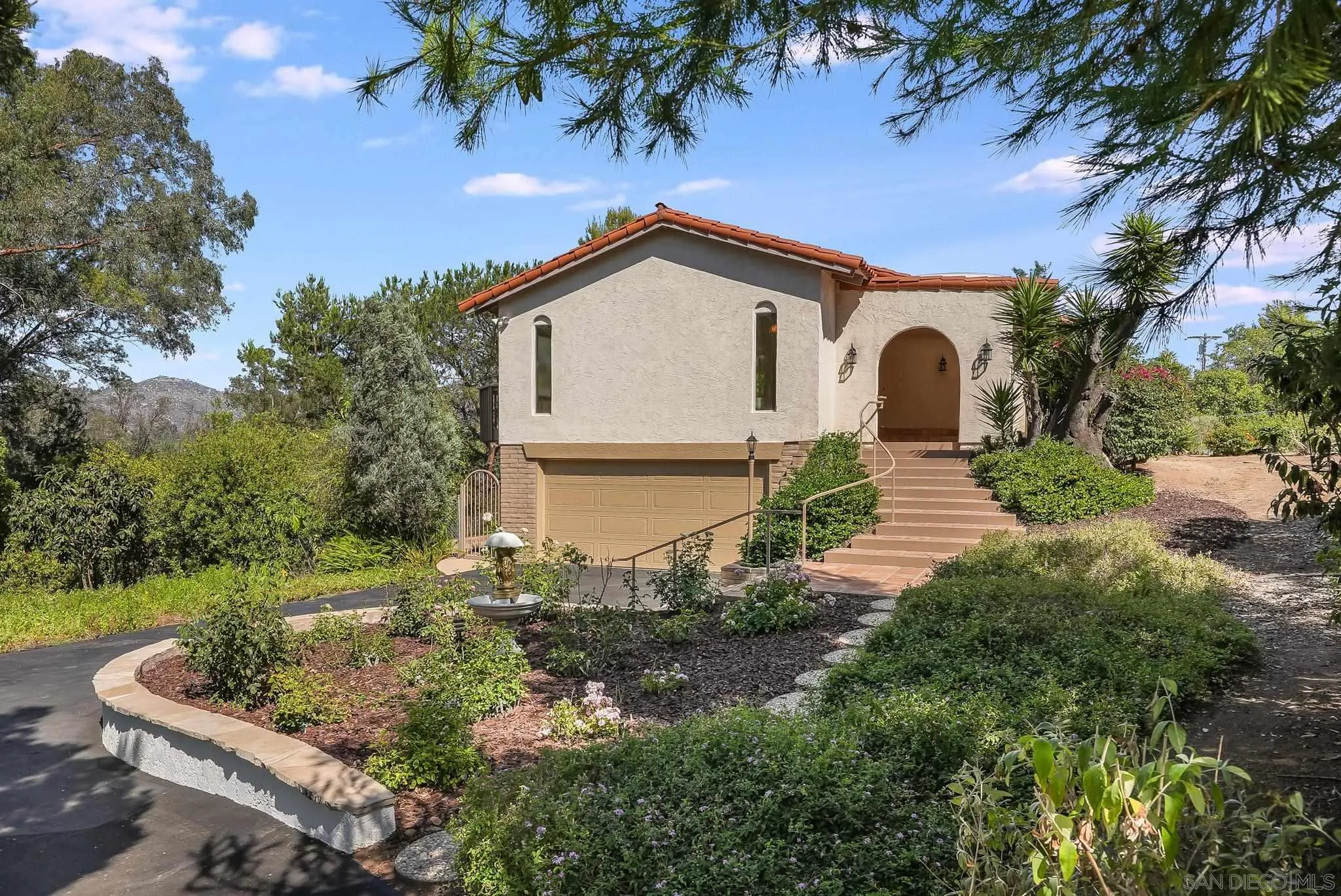 16456 Martincoit Road Poway, CA 92064 - Photo 2 of 55 a view of a house with a small yard and large tree