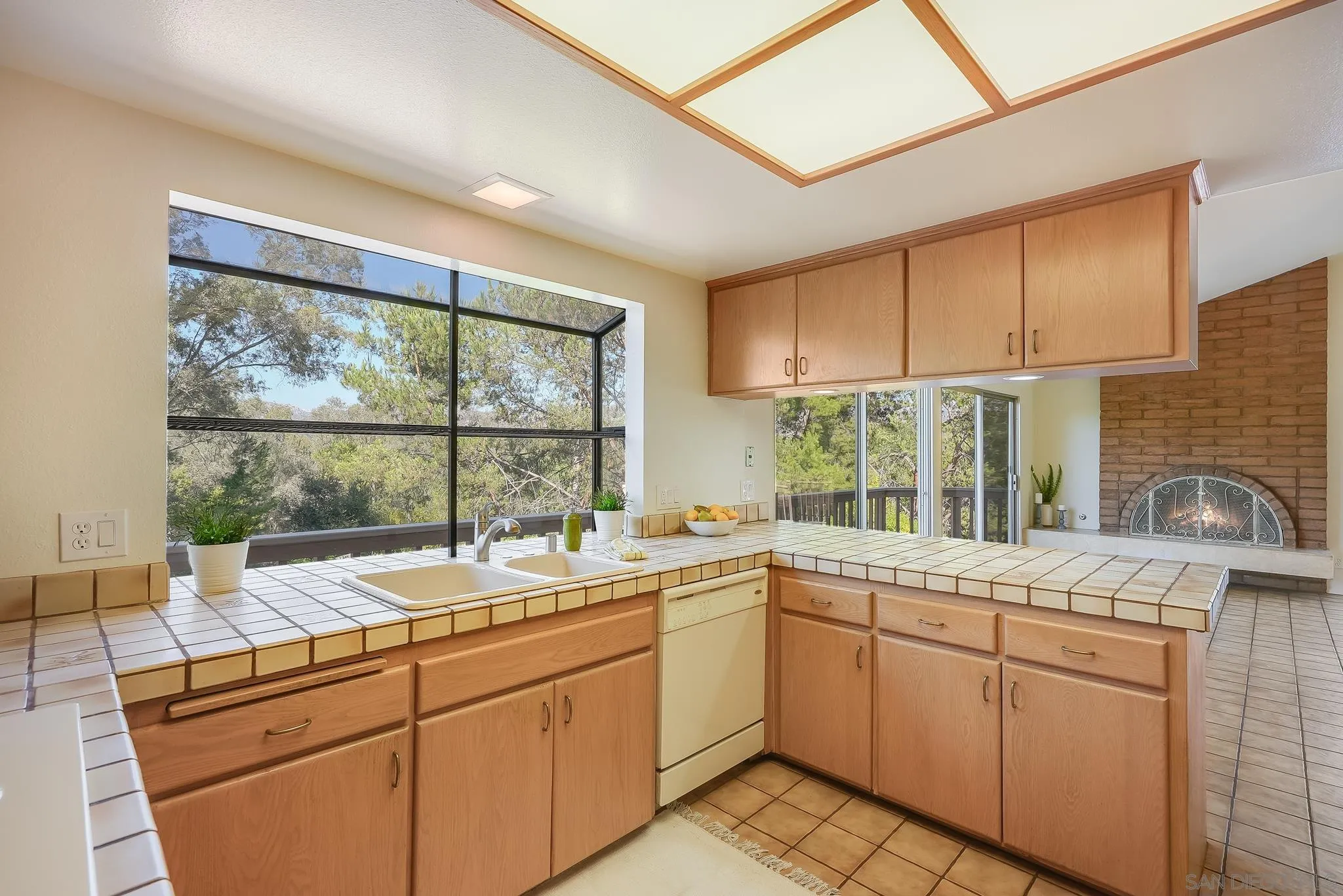 16456 Martincoit Road Poway, CA 92064 - Photo 23 of 55 a kitchen with a sink window and cabinets