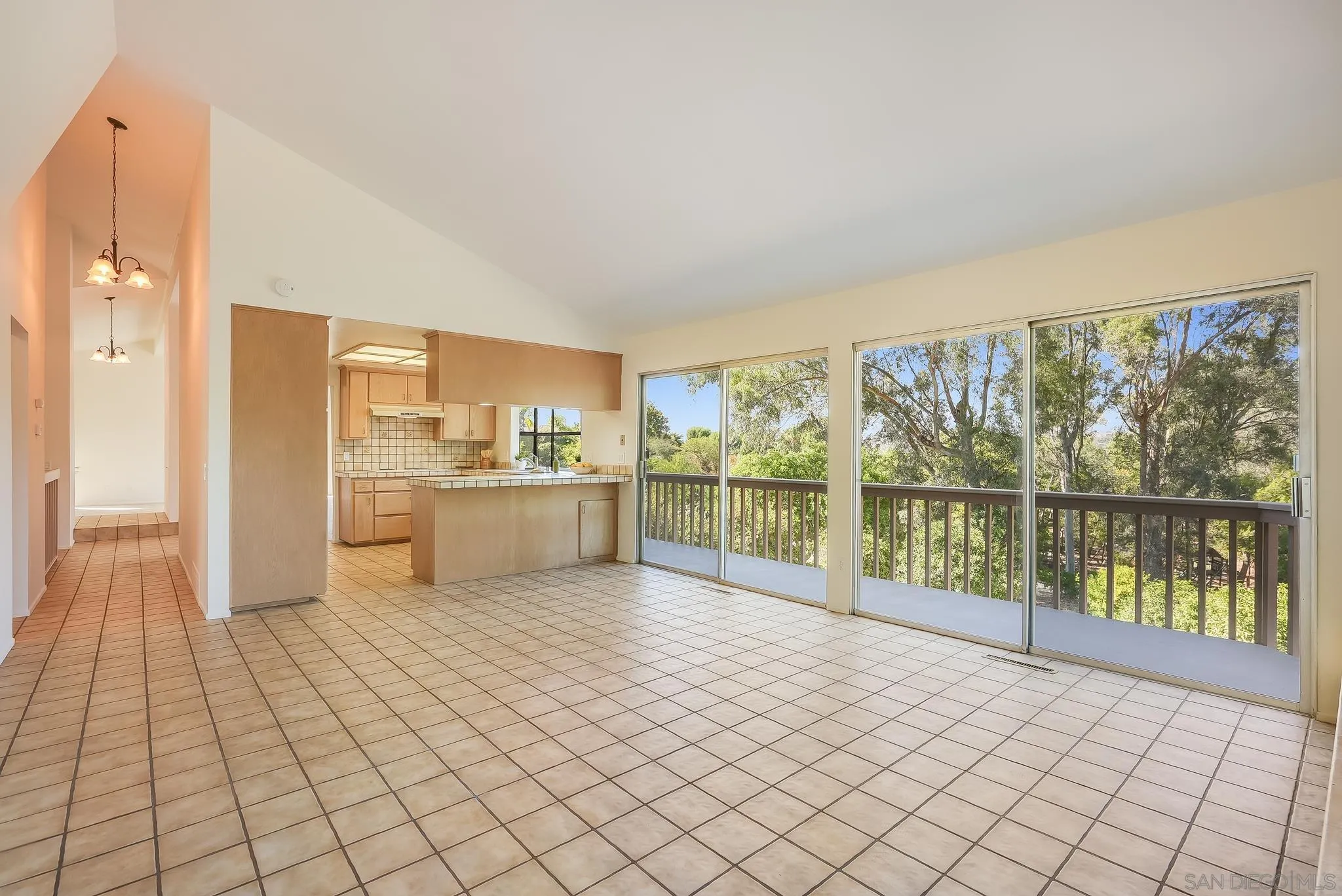 16456 Martincoit Road Poway, CA 92064 - Photo 25 of 55 a view of a kitchen with kitchen island a sink and a large window