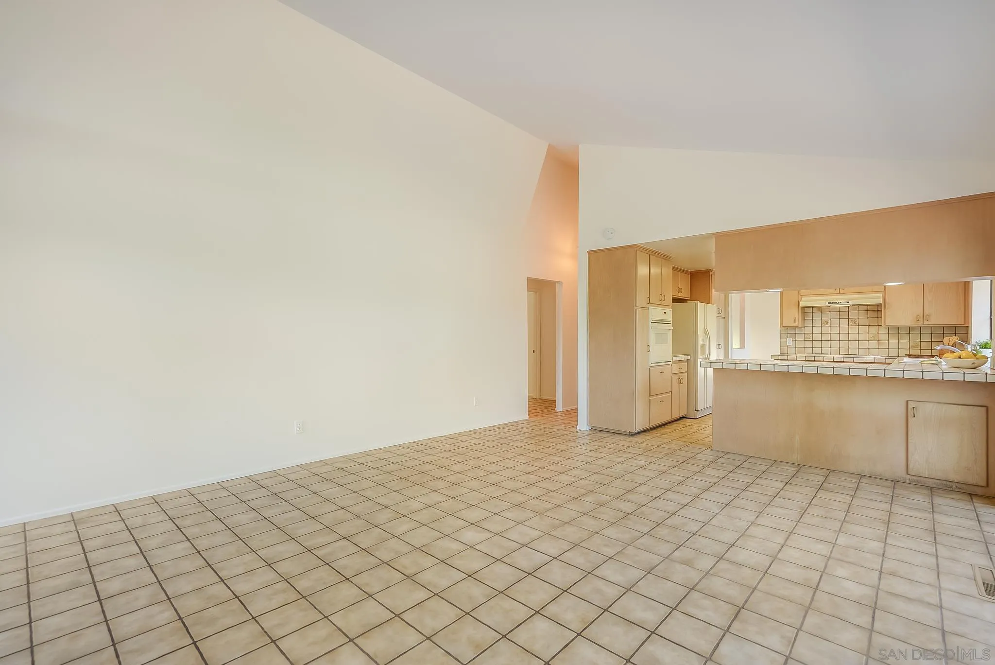16456 Martincoit Road Poway, CA 92064 - Photo 26 of 55 a view of a kitchen with white cabinets