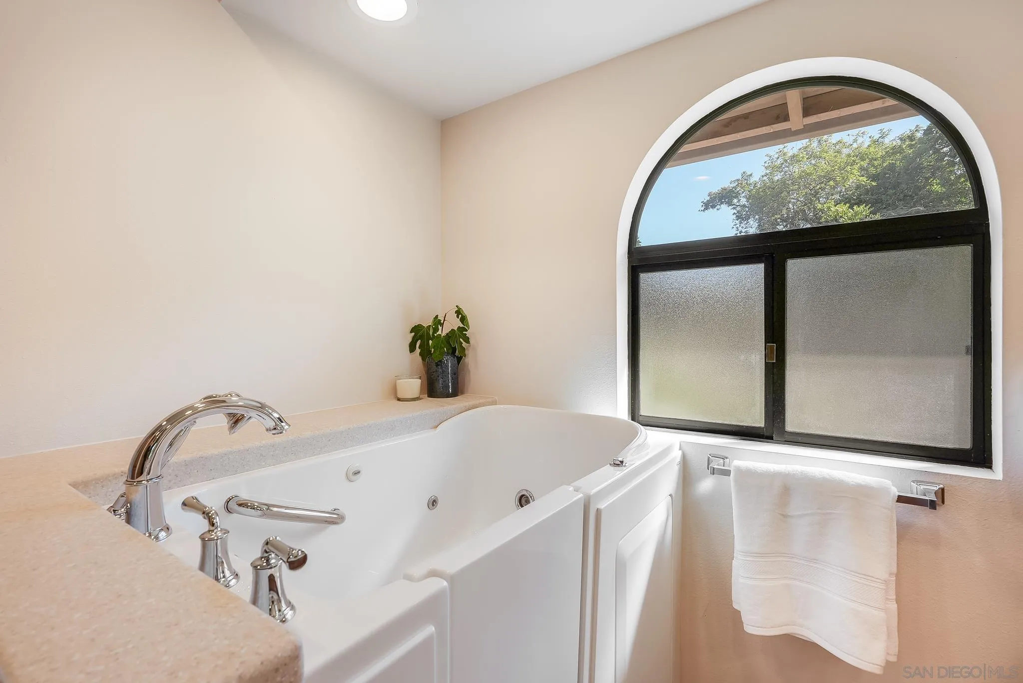 16456 Martincoit Road Poway, CA 92064 - Photo 32 of 55 a bathroom with a tub and a window