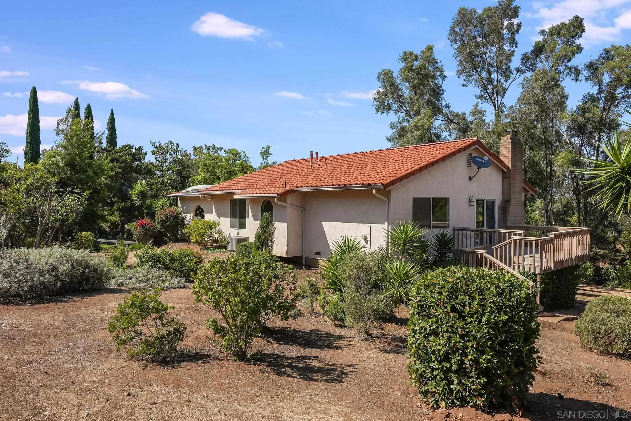 16456 Martincoit Road Poway, CA 92064 - Photo 4 of 55 a front view of a house with a yard