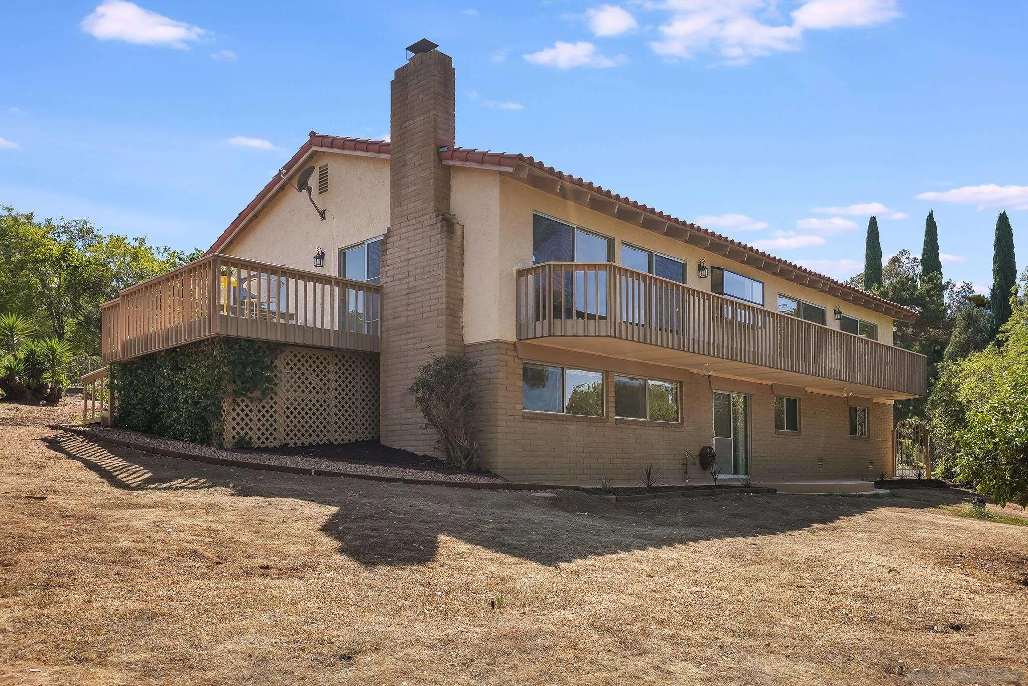 16456 Martincoit Road Poway, CA 92064 - Photo 6 of 55 a view of a house with a yard
