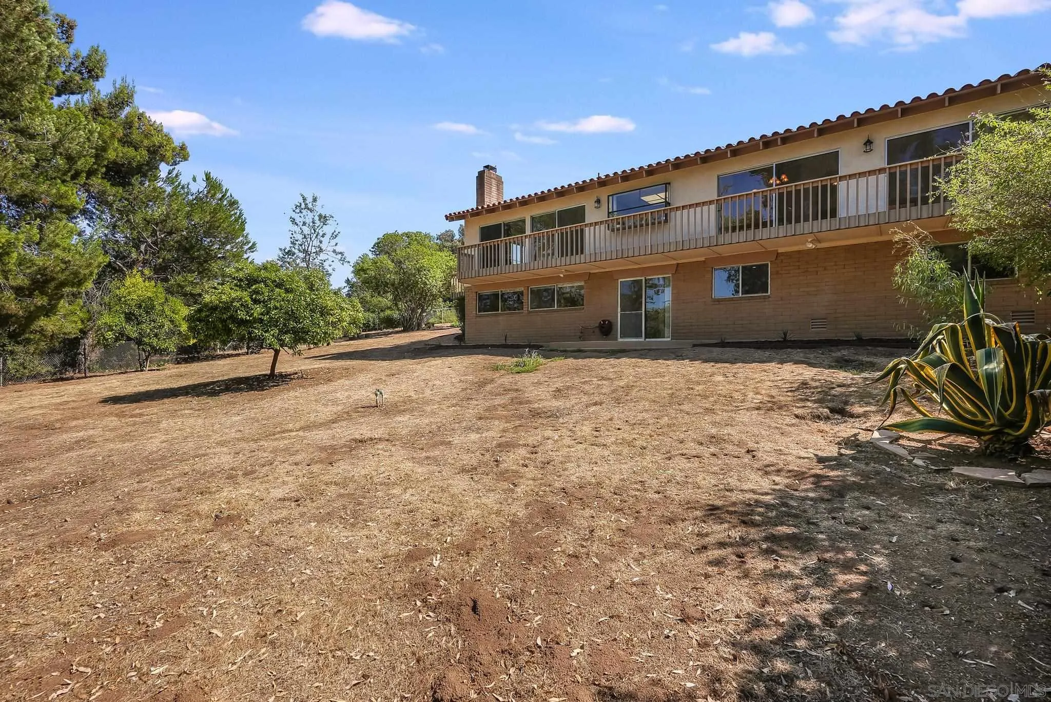 16456 Martincoit Road Poway, CA 92064 - Photo 7 of 55 a front view of a house with a yard